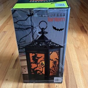 Halloween Lantern - 7.1”Lx7.1”Wx15.2”H.  Includes LED candle with auto timer.